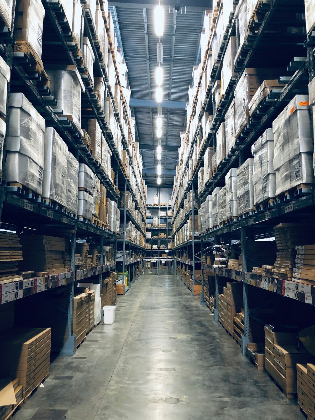 Parcels moving along a sorting conveyor in a fulfilment centre